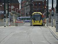 Tram 3070 stood at Oldham tram/bus interchange looking towards Union St with 3071 behind on 21/08/2013. Photo  R. Clarke